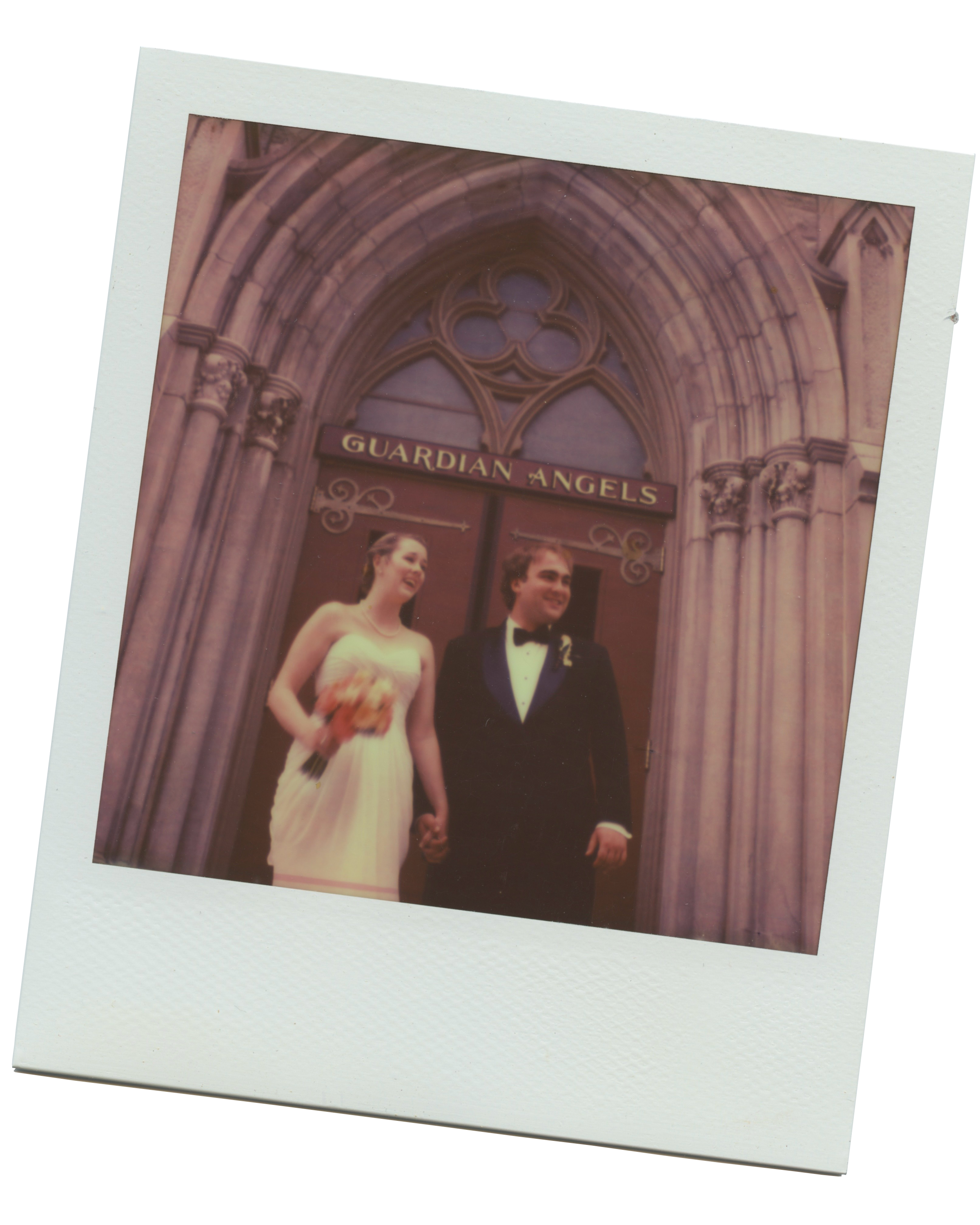 Polaroid of wedding photos on the church steps. Under the golden lettering of the church doorway, “Guardian Angels” shines above the bride and groom, both smiling and holding hands.