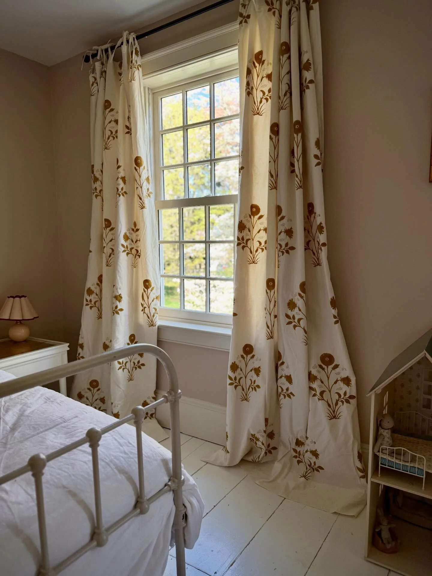 Sunday afternoon finally getting these curtains up in time for the dogwood to bloom