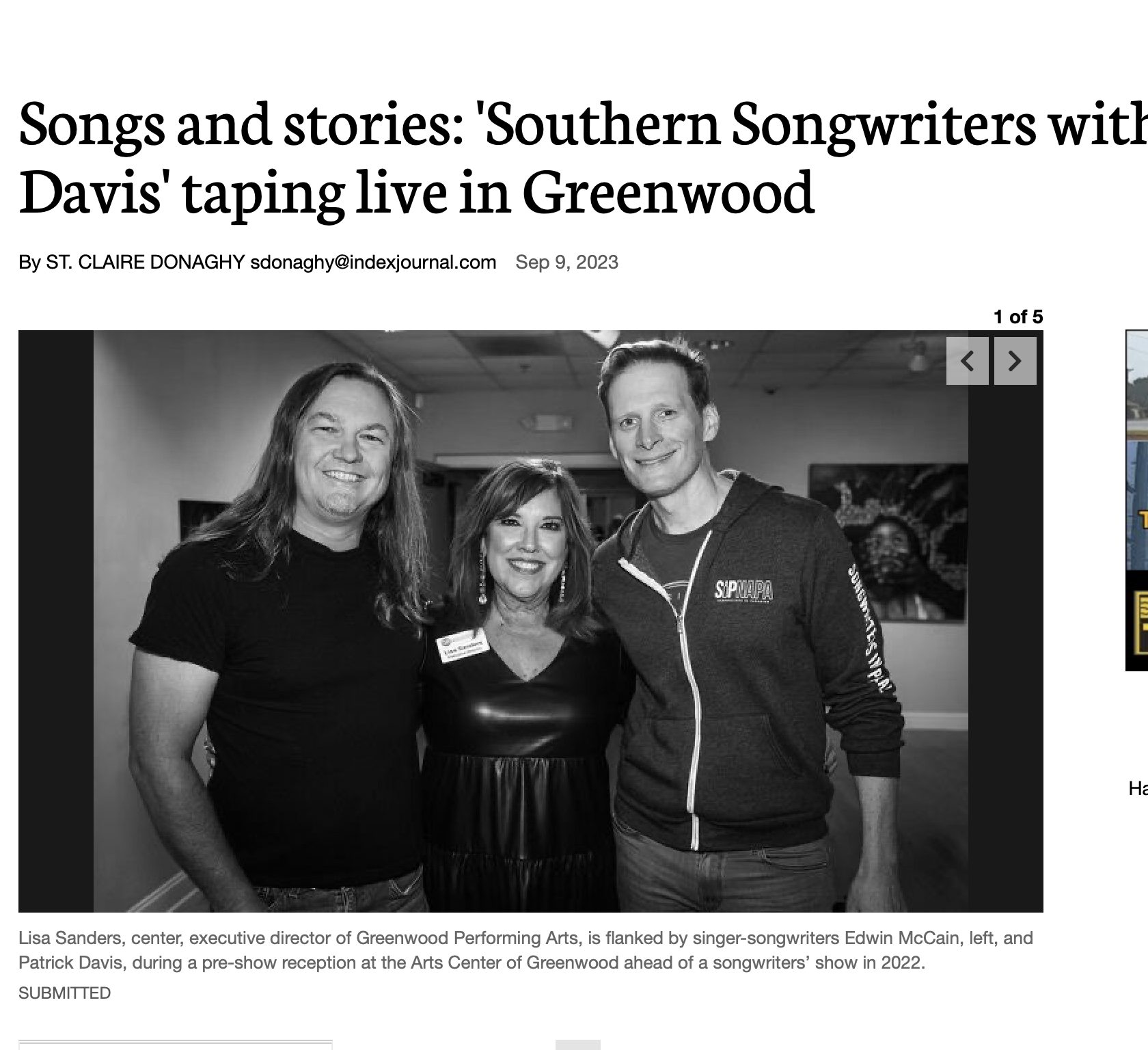 Black and white photo of three people, Lisa Sanders, Edwin McCain, and Patrick Davis, smiling and standing together at an event.