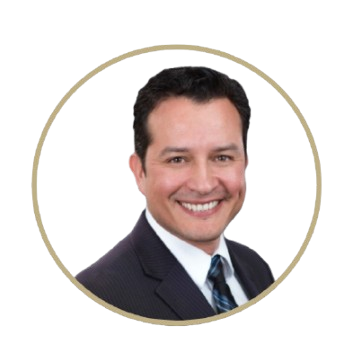 Isait in black suit and tie