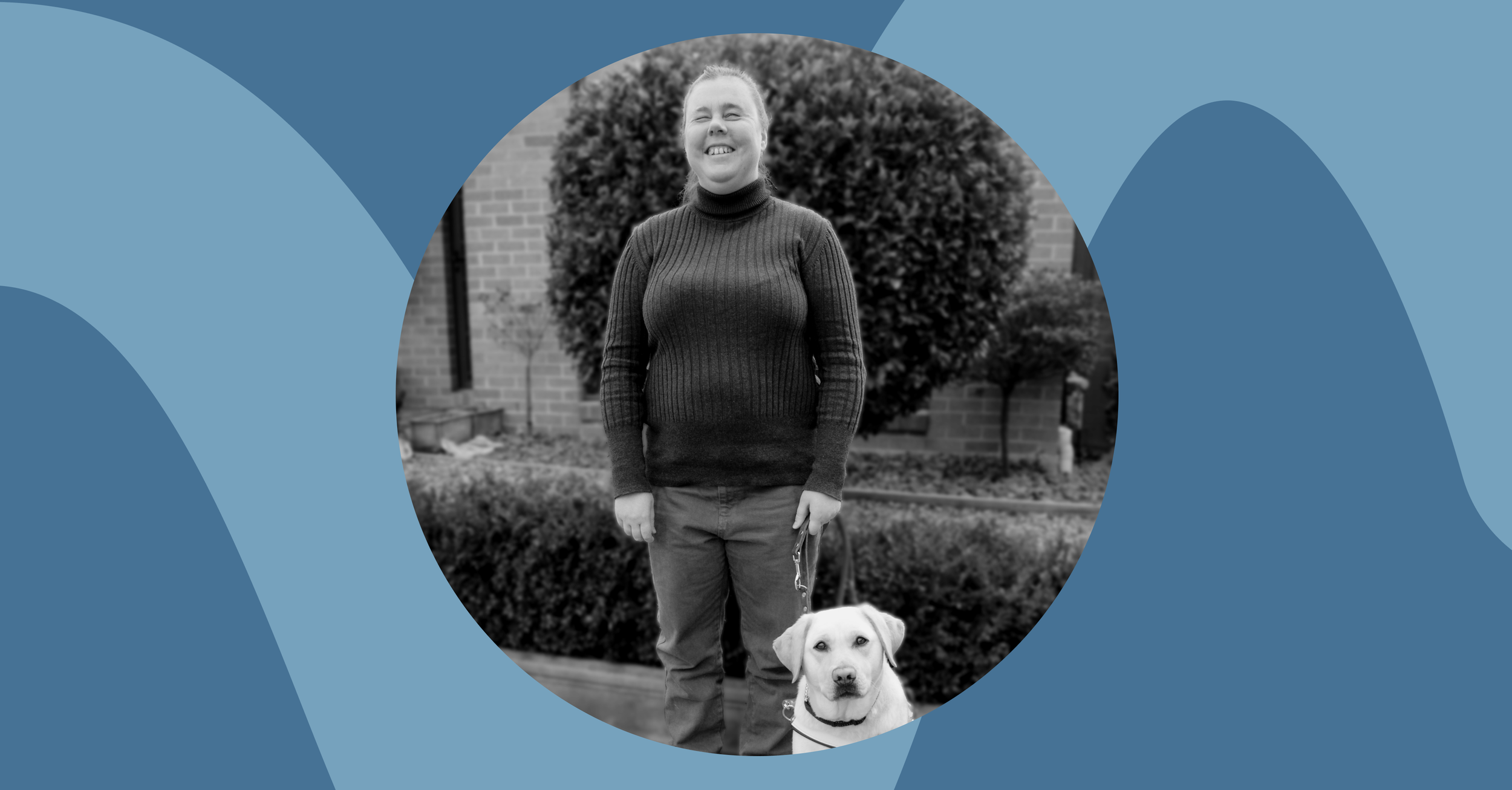 Paula smiling, holding her guide dog Kristen