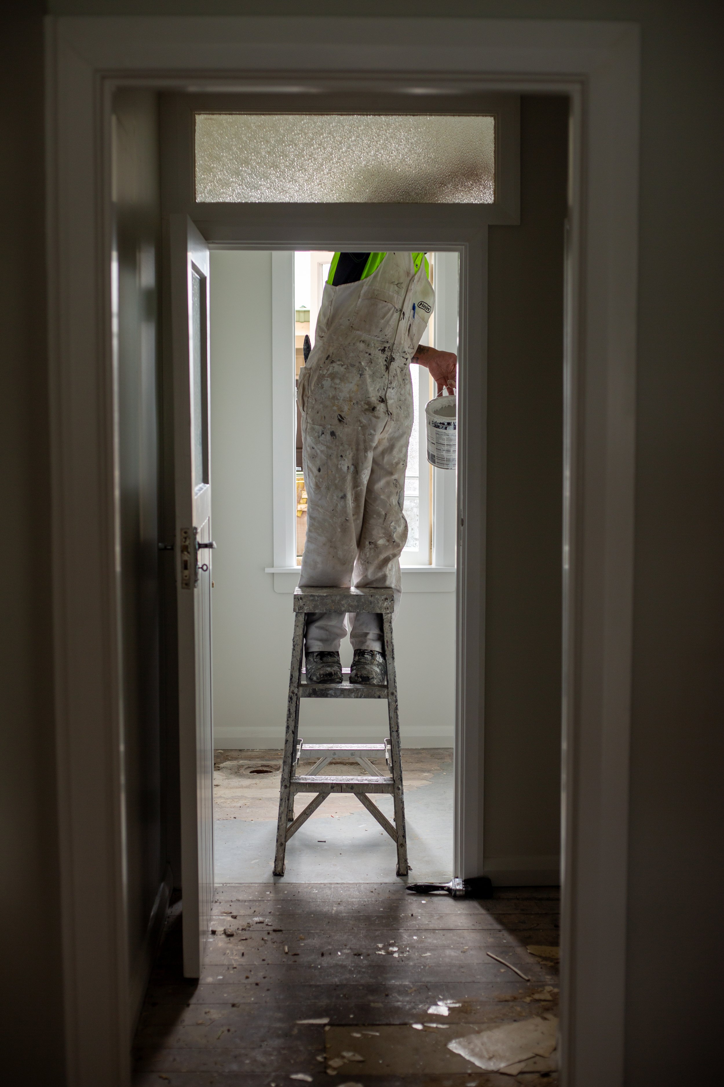 Painter working on Cash Flow Hack renovation site for Wolfe Property Client