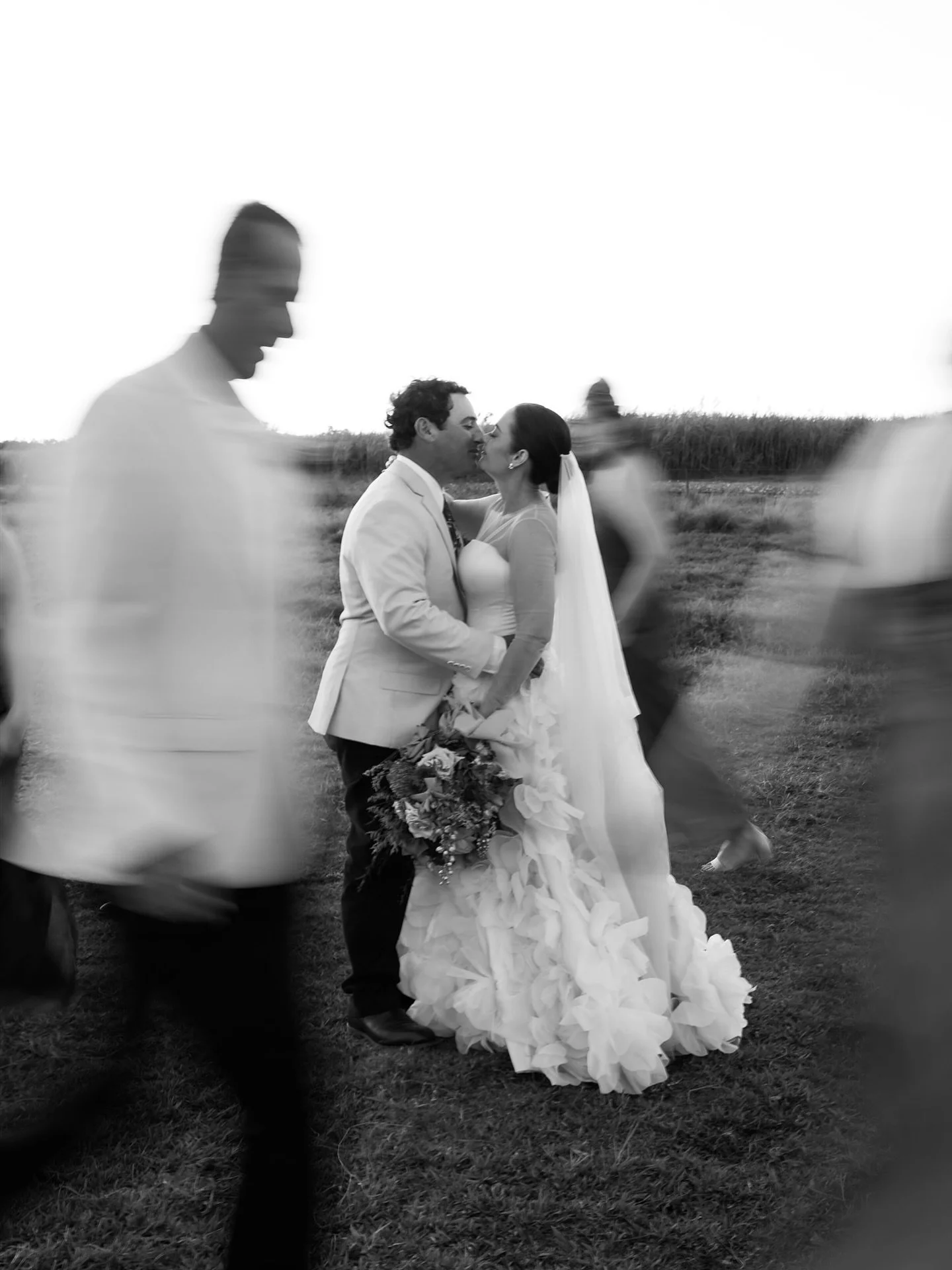 Time moved, but they didn&rsquo;t✨
In a blur of laughter, footsteps and motion; there they stood, steady in love.

A frame that feels more like a memory than a photograph.

#whitsundaywedding #whitsundayweddingphotographer #whitsundayweddings #whitsu