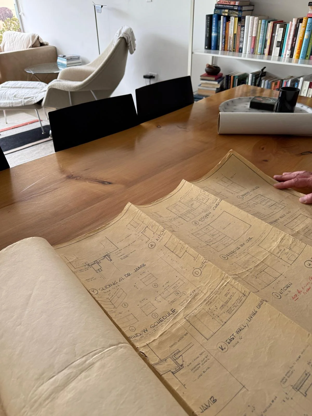 Collage of interior home design images featuring wood and natural materials, including a modern bathroom with a stone vanity, a kitchen with wooden cabinets, a brick fireplace, and various wood-paneled walls and furniture.