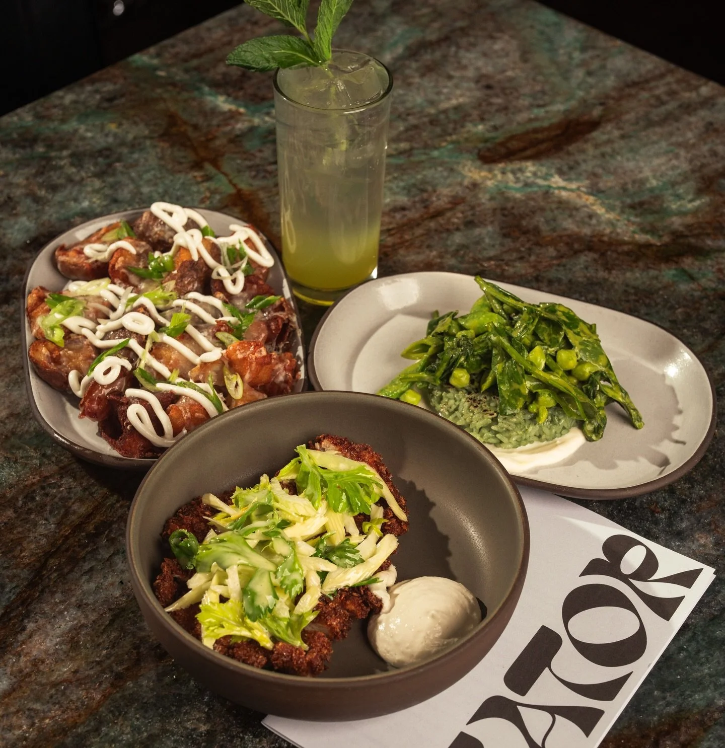 A perfect order&hellip;

Loaded potato bites, spring legumes, and dirty martini chicken, washed down with a celery shrub.