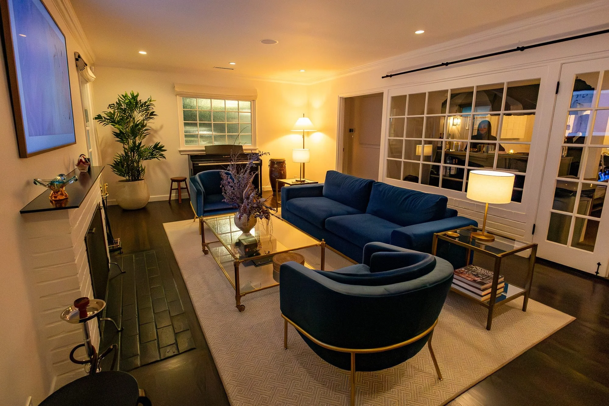 Living room with navy blue sofa and armchairs