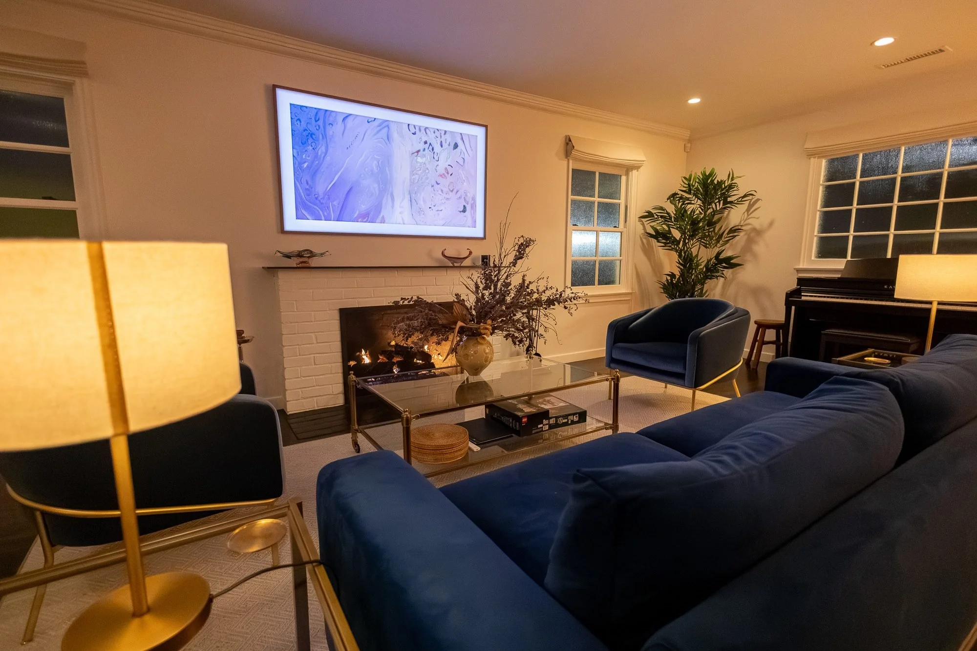 Living room seating area with television and fireplace