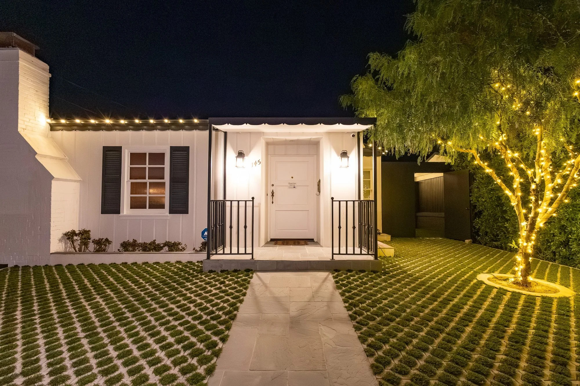 Close-up of the front entrance porch and door at night