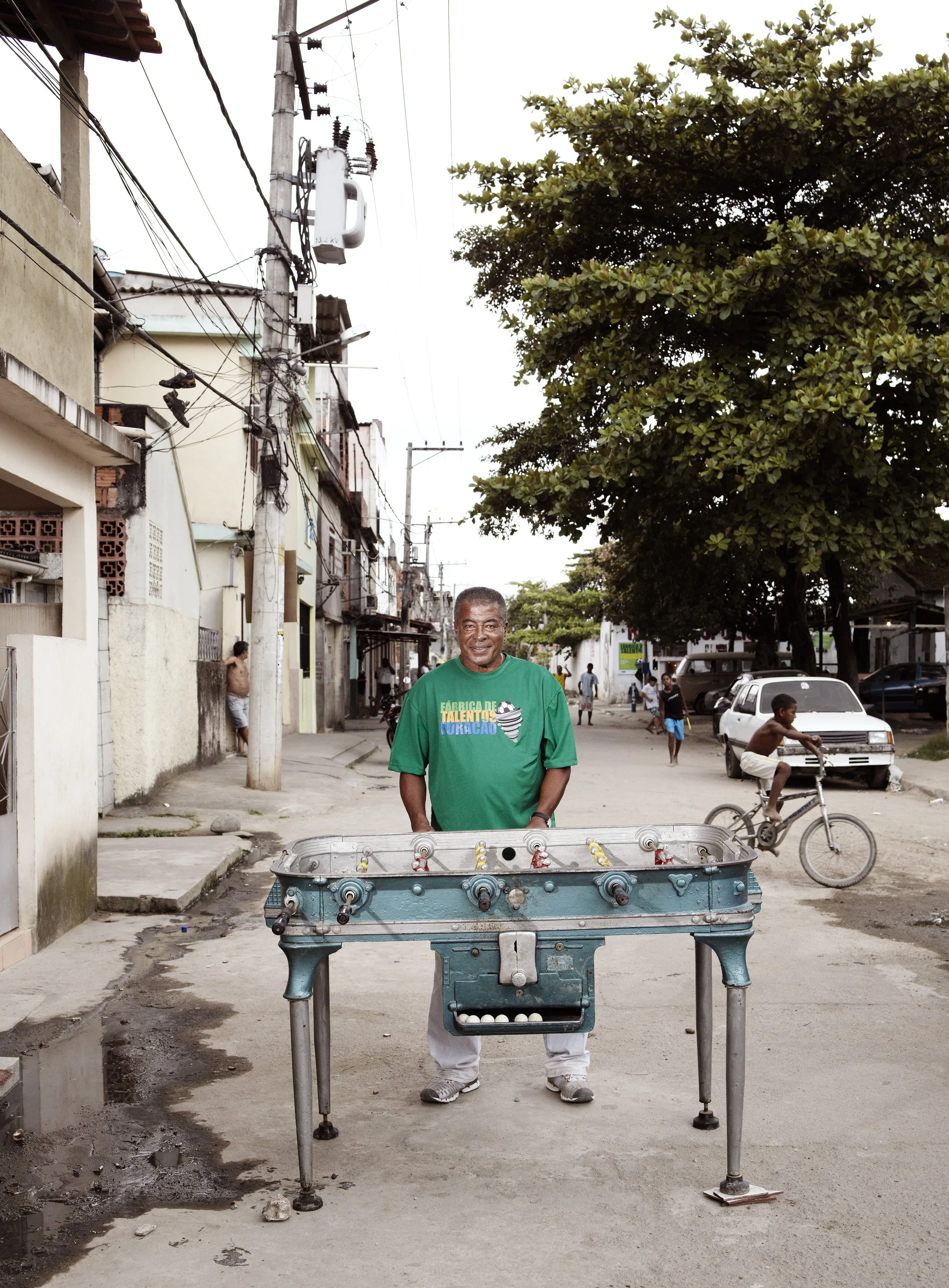 Jairzinho. Brazil. 1970. He scored in every match in the Finals. "I scored to make it 3-1 and they basically gave up."

Photographed in a Rio de Janeiro favela street. 
