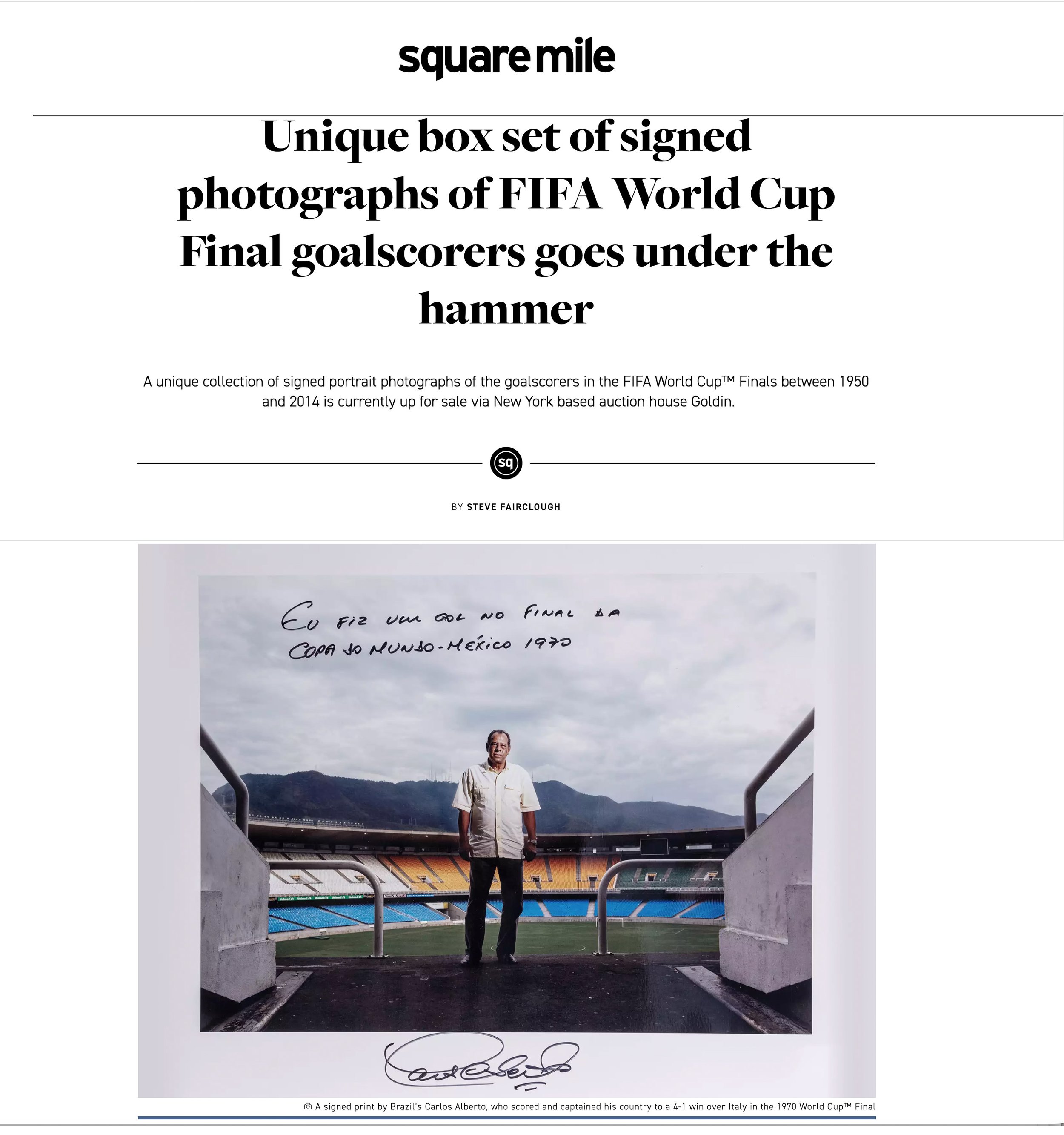 Photograph of a man standing on a sports stadium field, framed by an entrance with concrete walls and a metal railing. The man is identified as Brazil's Carlos Alberto, celebrating his team's 4-1 victory over Italy in the 1970 World Cup final. He is wearing a light-colored shirt and dark pants, with a scenic mountain view in the background.
