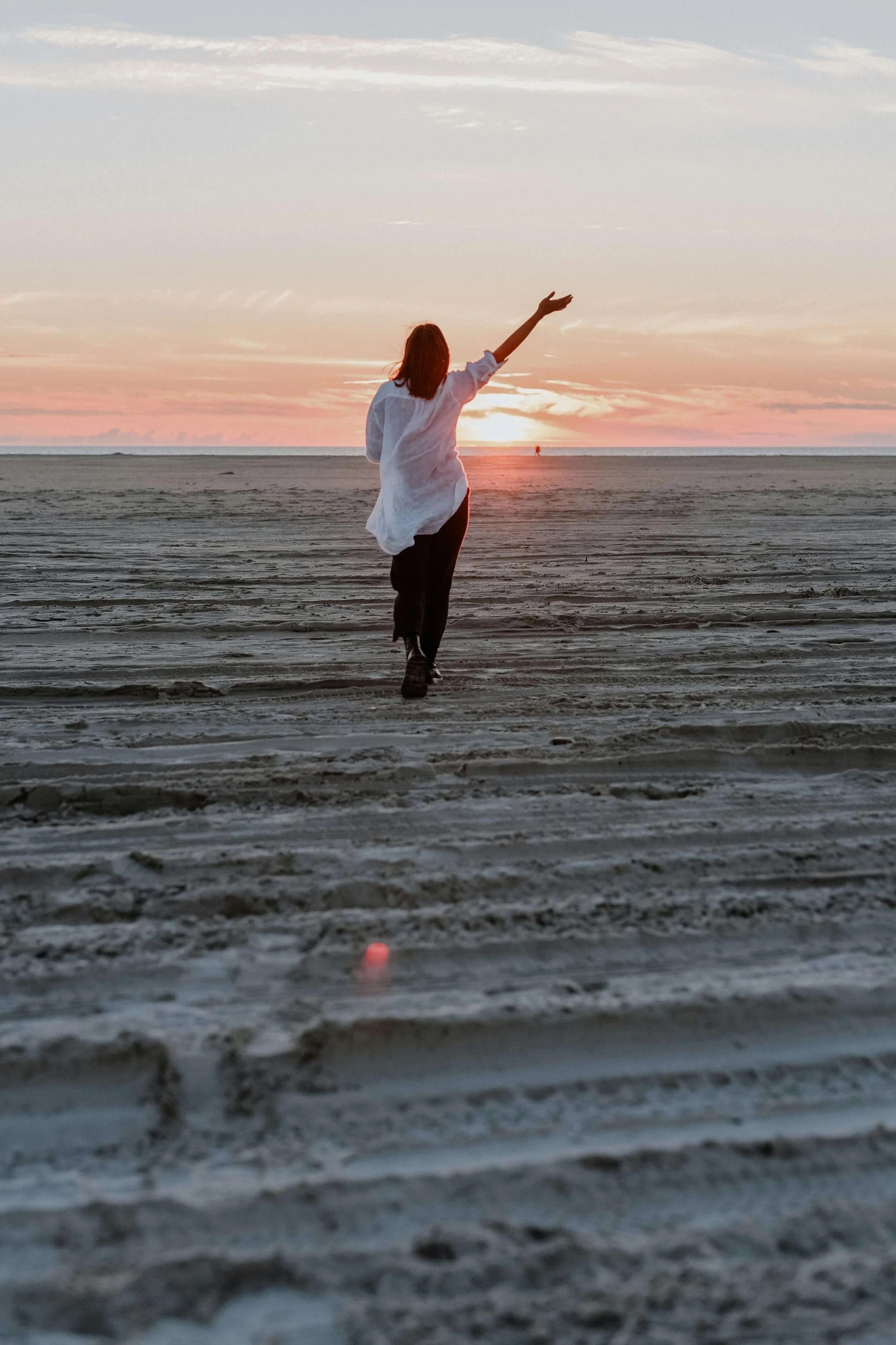A woman walks freely with Emotional regulation from therapy in Columbus. You learn to regulate your emotions, calm your nervous system, and move forward without being controlled by emotional reactions.