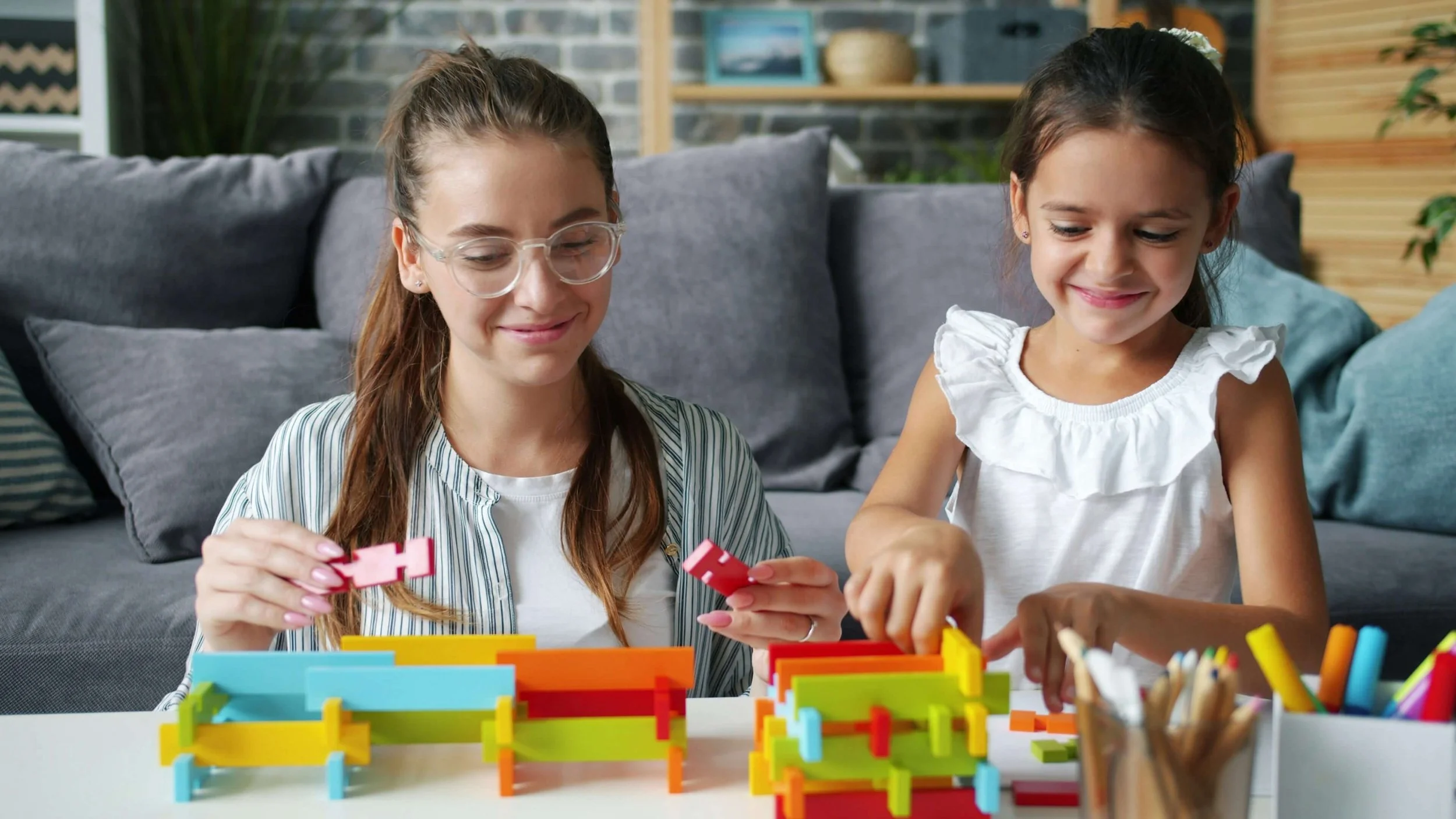 A mother and daughter laugh and play together as family experiences shape people-pleasing patterns. Online Christian counseling in Columbus, OH, can help women heal from childhood wounds and develop healthier boundaries.