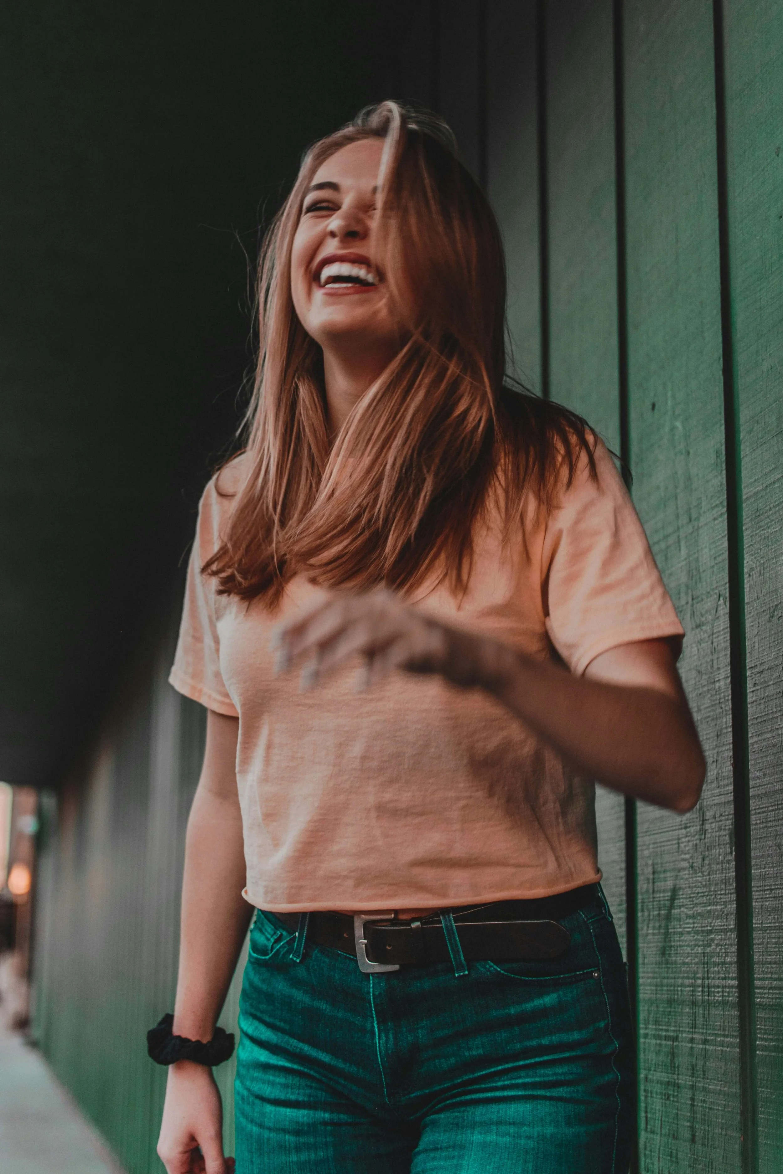 A woman laughs freely as she experiences hope and emotional healing after childhood trauma. Christian counseling in Columbus, OH, supports women seeking faith-based healing and restoration.