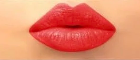 Close-up of red lipstick on lips