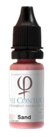 A small bottle of liquid with a dropper cap, labeled with the color name 'Sand'.