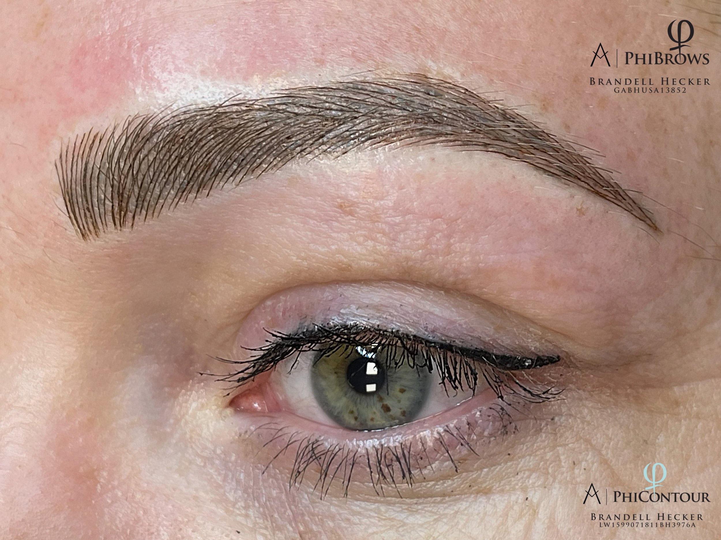 Close-up of a person's eye with professional eyelash extensions and eye makeup, including eyeliner and mascara.