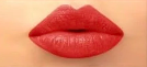 Close-up of red lipstick on lips