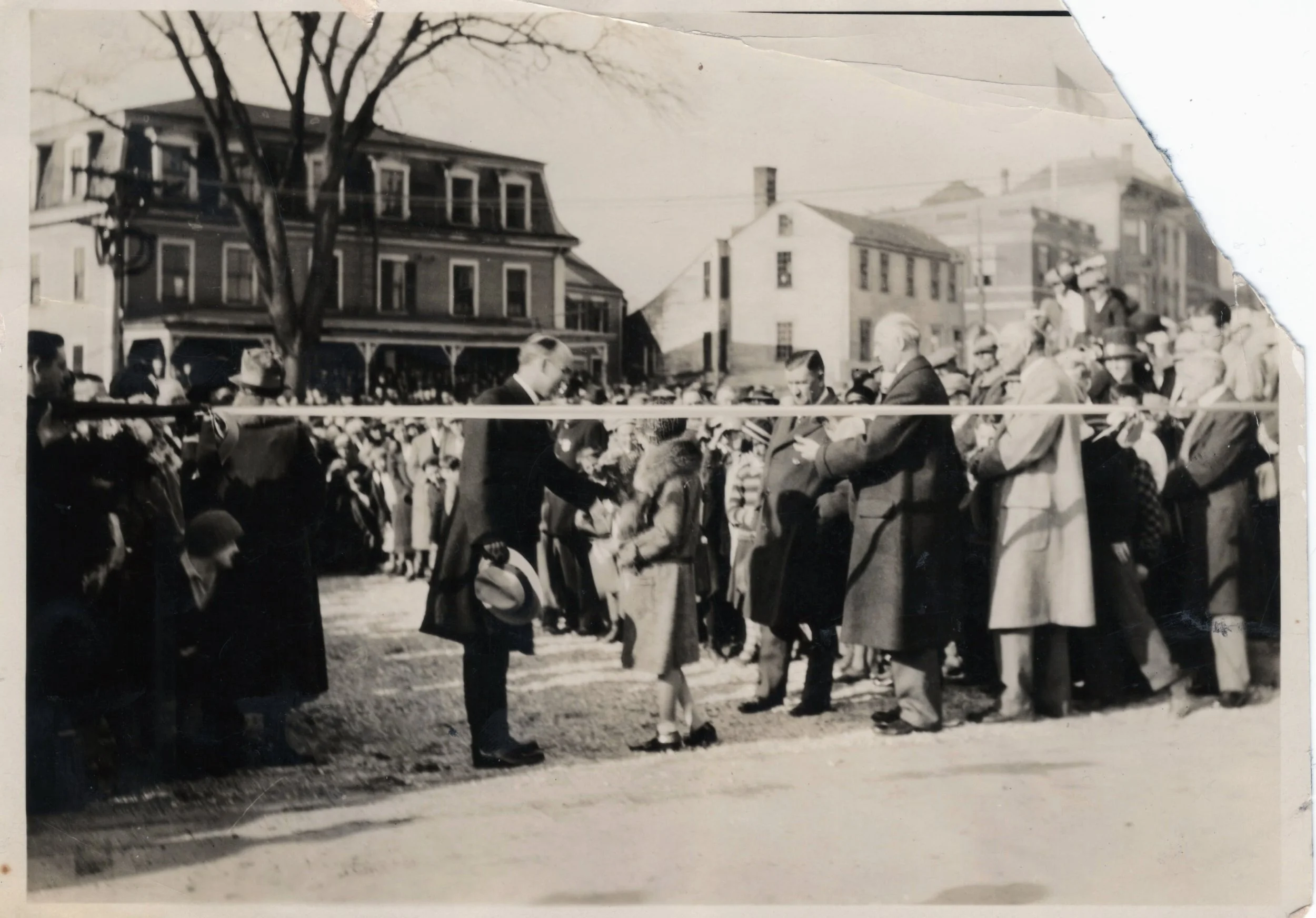 Governor Ralph Brewster prepares to cut the ribbon with a crowd of onlookers at a 1927 ceremony to open the Carlton Bridge. BHS2010.7