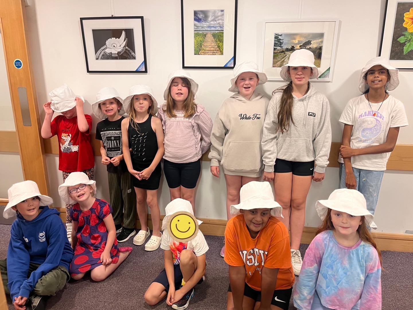 We made white cotton bucket hats and then tie dyed them!