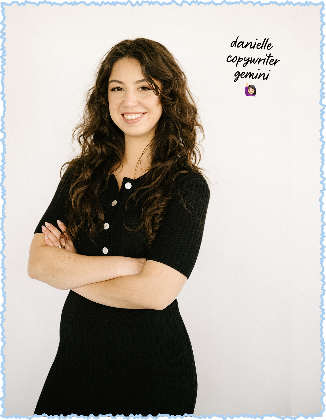 A woman with long, curly brown hair, wearing a black ribbed dress with white buttons, standing with her arms crossed and smiling at the camera. The background is plain white, and text on the top right reads, "danielle copywriter gemini" with a waving hand emoji.