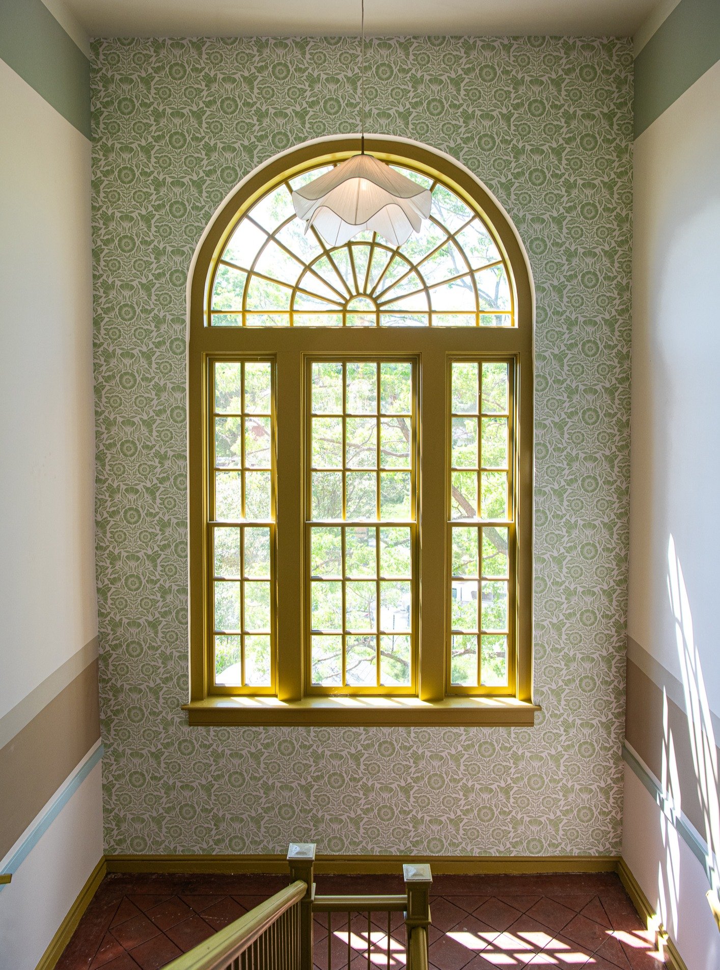 A former school building with long corridors needed more than repetition. At The Flora, we created a design narrative that evolves floor by floor

The first floor grounds residents in rich terracotta tones, moody color, botanical details, and organic