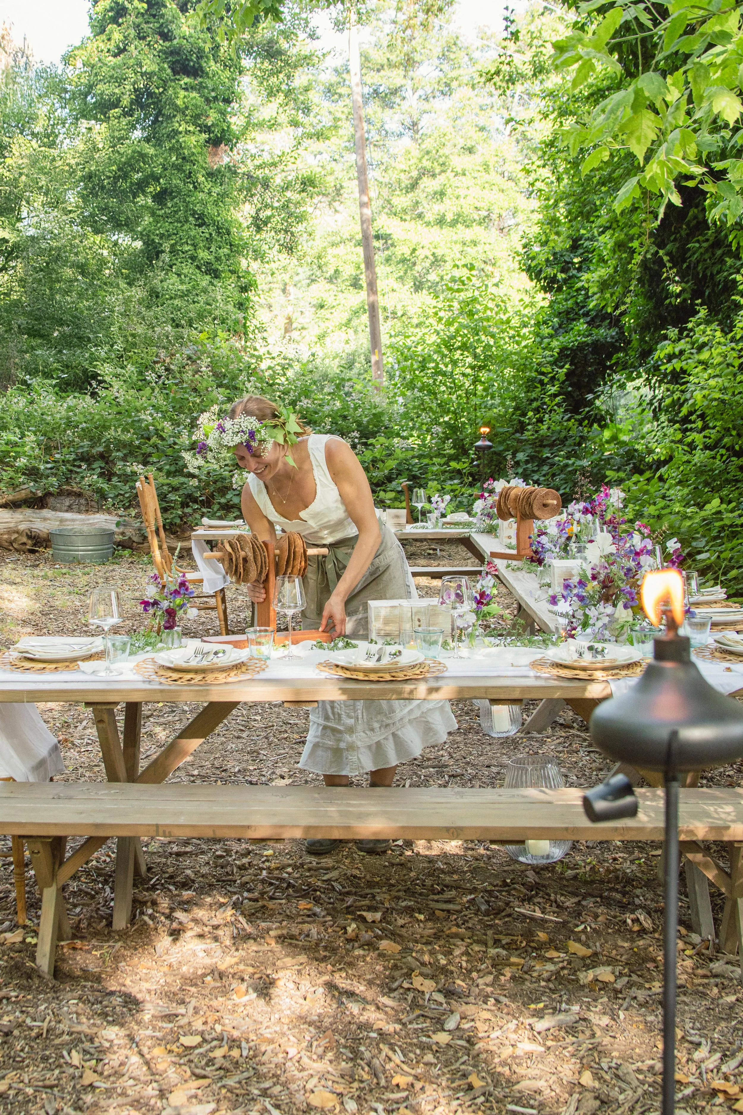Intentionally crafted outdoor tablescape with seasonal flowers and handmade details, reflecting Hearth & Harvest’s thoughtful, purpose-driven approach to event design.