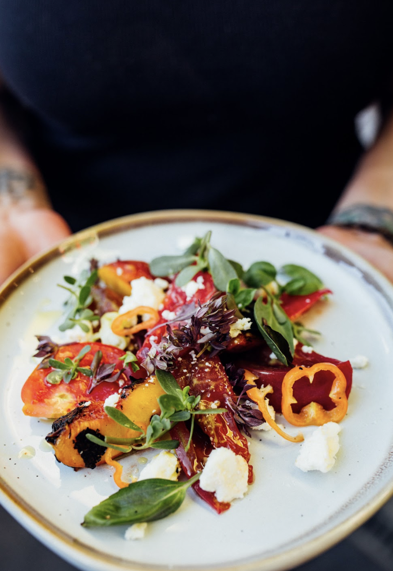 Summer live-fire catering menu example from Hearth & Harvest, featuring bright, seasonal flavors and outdoor dining for San Diego events.