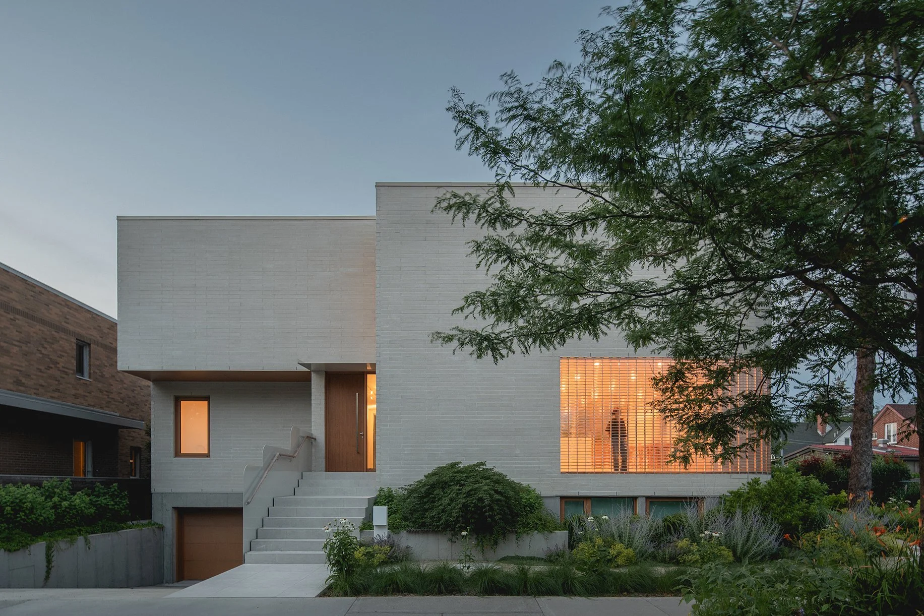 architecture-exterior-contemporary-minimalist-design-glass-facade-street-view-glass-bricks-night-shot-lens-montreal.jpg