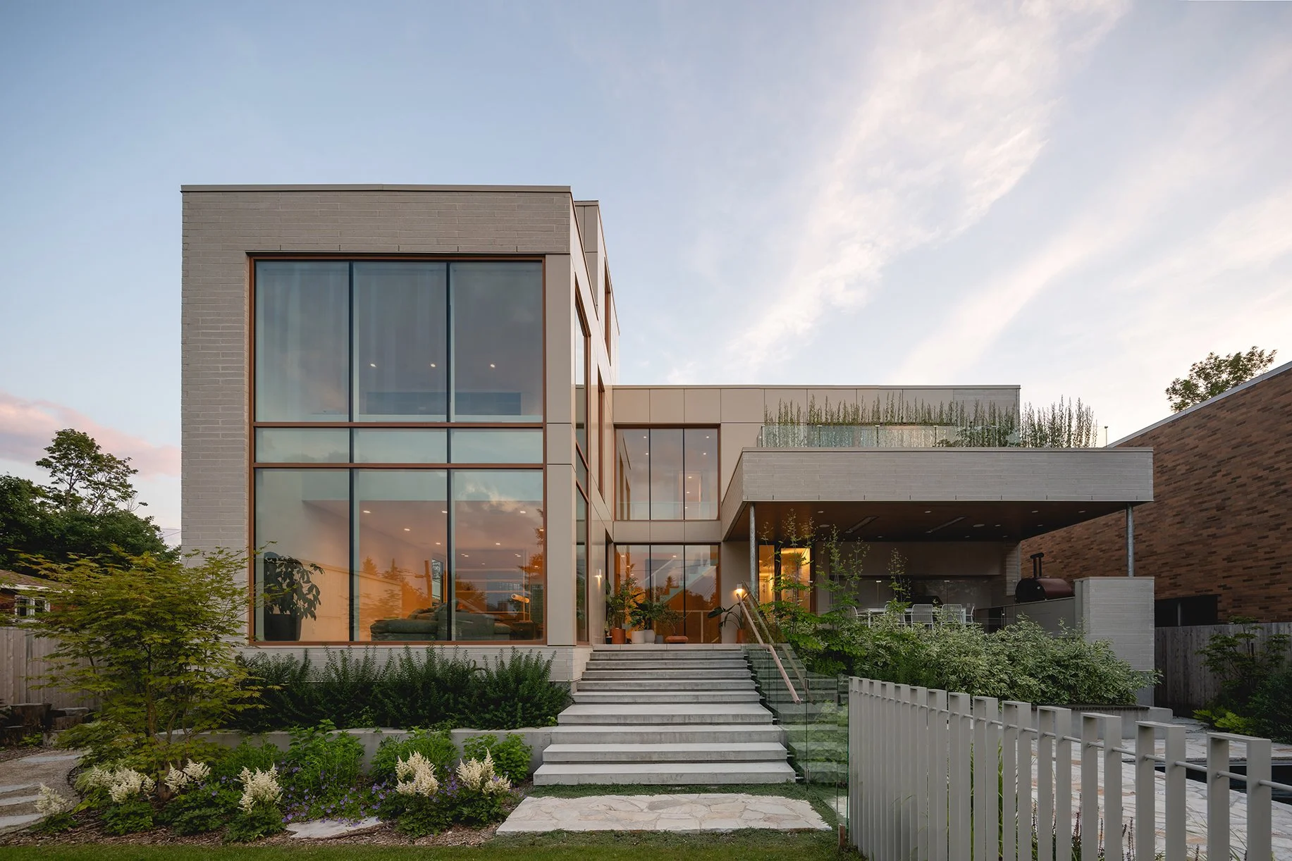 architecture-exterior-contemporary-minimalist-design-glass-facade-garden-green-roof-stone-montreal.jpg