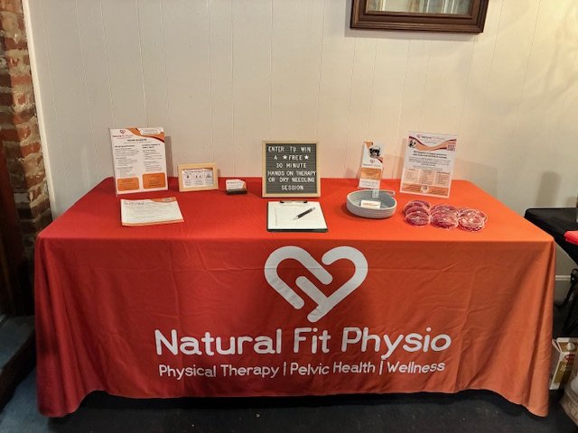 table displaying marketing materials at an event