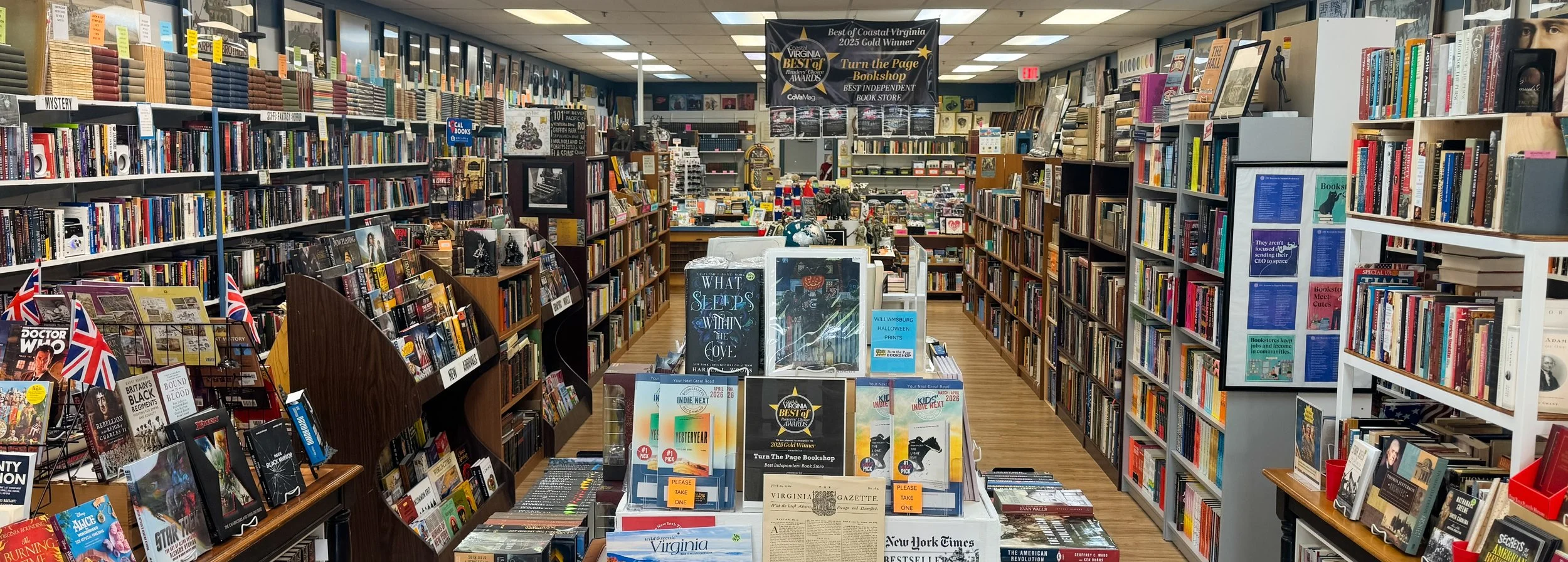 Wide angle view of bookstore entrance showcases our bookshelves and displays.