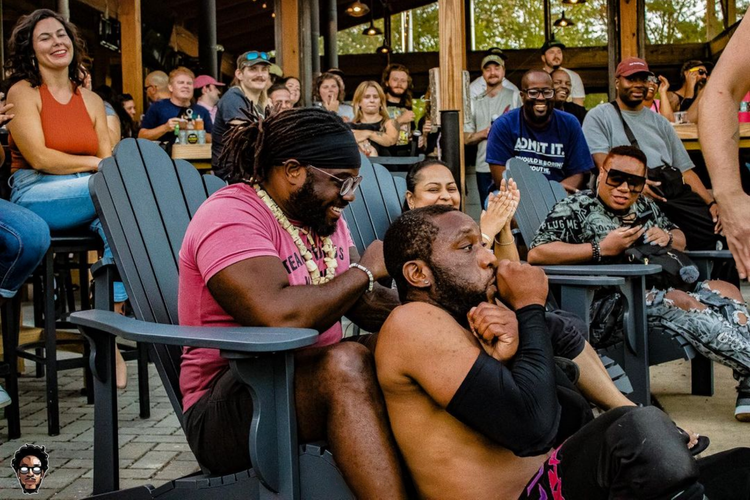 Chefs Wellington & Marlena enjoying the crowd at a Deep South Wrestling event