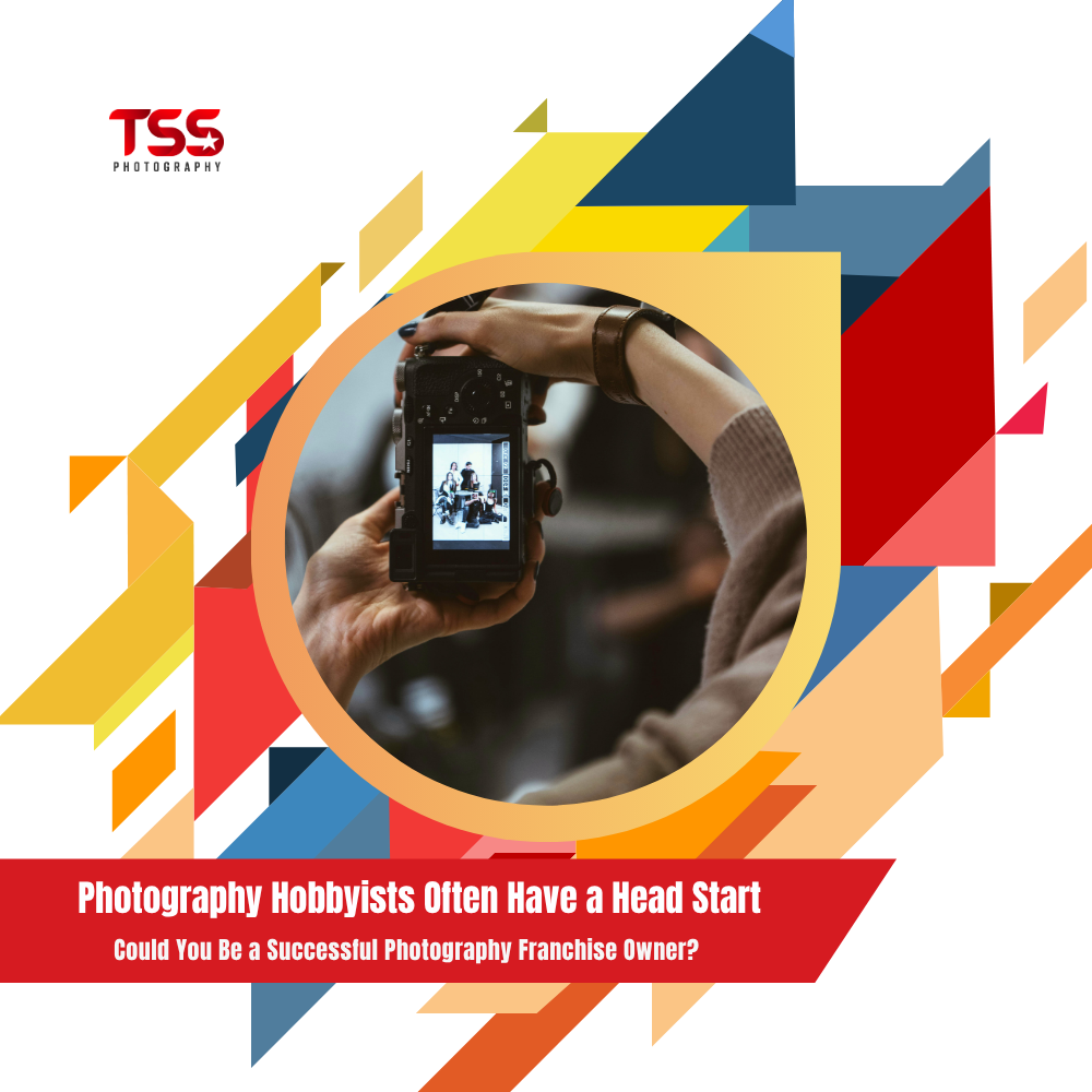 Photography hobbyist reviewing images on a digital camera for photography franchise ownership opportunities with TSS Photography
