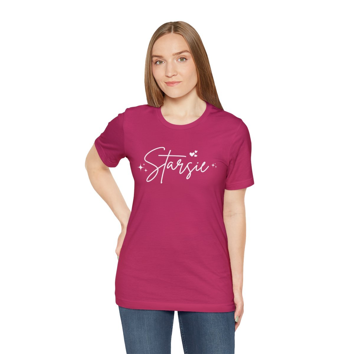 Person wearing a fuchsia t-shirt with 'Starsie' text and heart graphics, white background.
