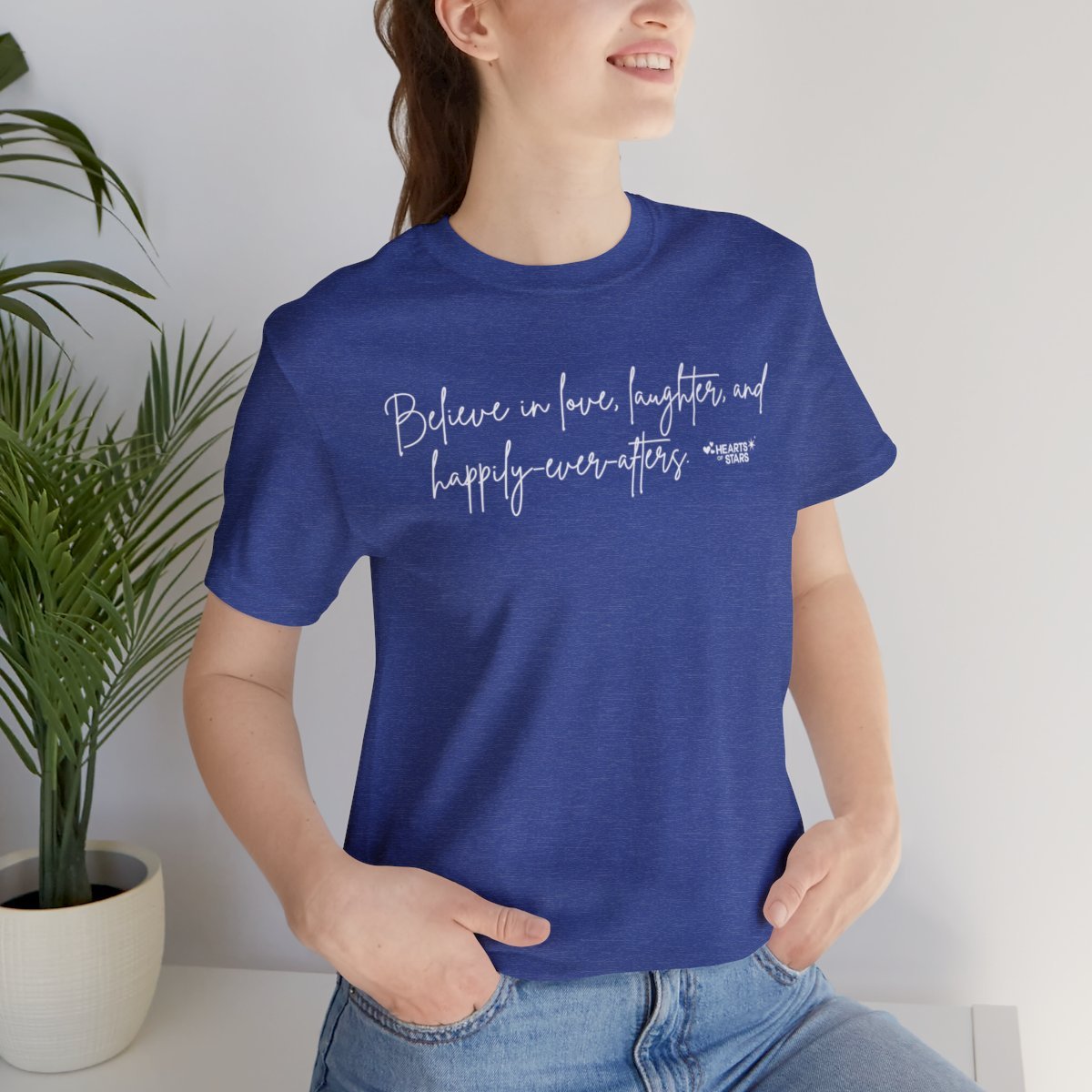 Person wearing a blue T-shirt with an inspirational quote