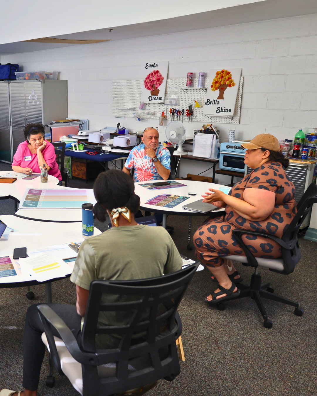 Amy and Lisa from Southside ReLeaf gather with Spanish-speaking residents at Hickory Hill Community Center on May 12, 2026, to discuss how to create a cooler, healthier city.