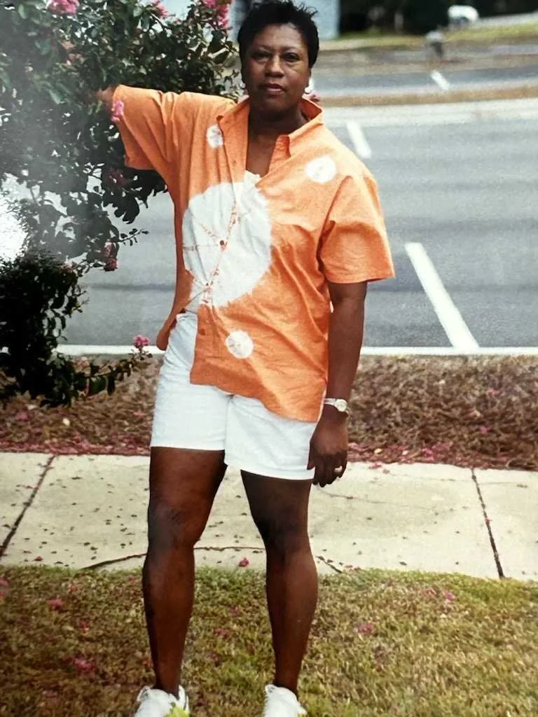 My mother, standing next to a Crepe myrtle tree that my great-grandmother planted in the 80s as a marker for the home they lived in on McFarland Street.