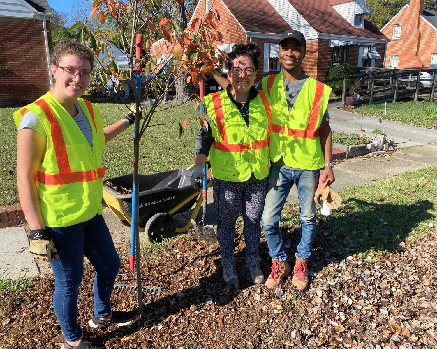Volunteers pose with a tree they planted in the Davee Gardens neighborhood in the fall of 2022 with Southside ReLeaf. Davee Gardens is located in a Greening Southside Priority Area due to overlapping social vulnerabilities.