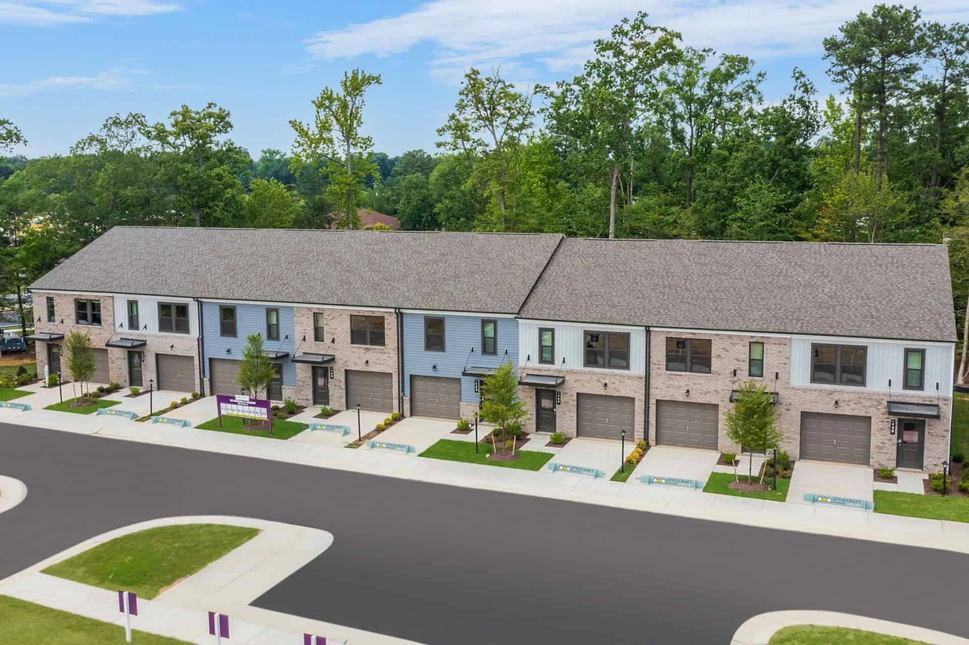 These two-story townhomes are part of The Crossings at Mulberry in Henrico, developed by StyleCraft Homes. The community includes affordable housing partnership units through the Henrico County Housing Trust Fund.