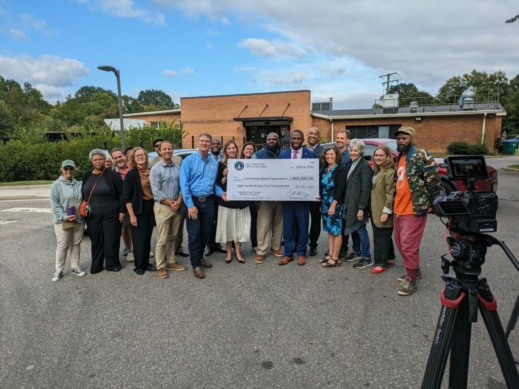 City officials and grantees of the Neighborhood Climate Resilience Grant in 2024 gather for a group photo at the press event announcing the grantees