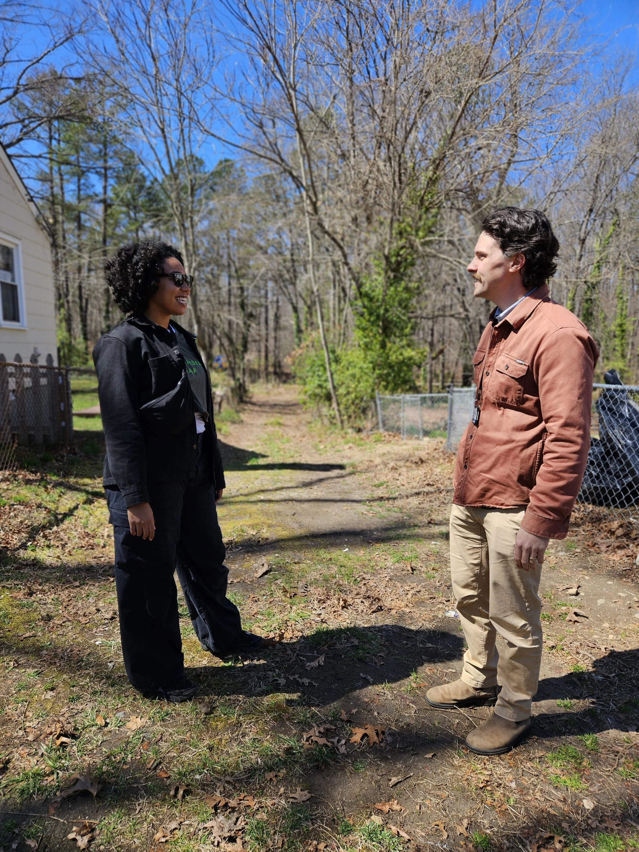 Southside ReLeaf’s Greening Coordinator, Syd Collier, talks to Michael Webb, the City’s Urban Forester, at the International Day of Forests Outdoor Learning Classroom at Ernest Road Park in March, 2025.