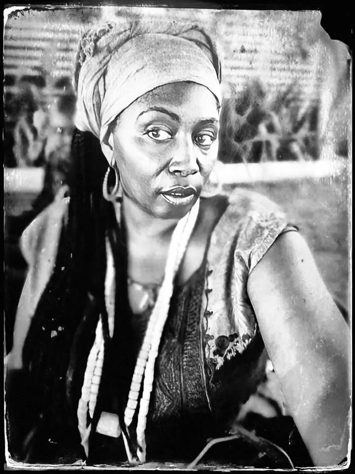 Free Bangura Sama wearing chieftain seabeads and ceremonial garments at home in Sierra Leone