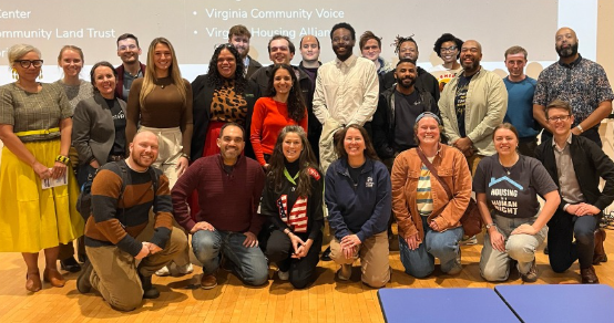 Group photo of some of the partners who are part of Homes for All Our Neighbors at a Code Refresh listening session event for Southside residents.
