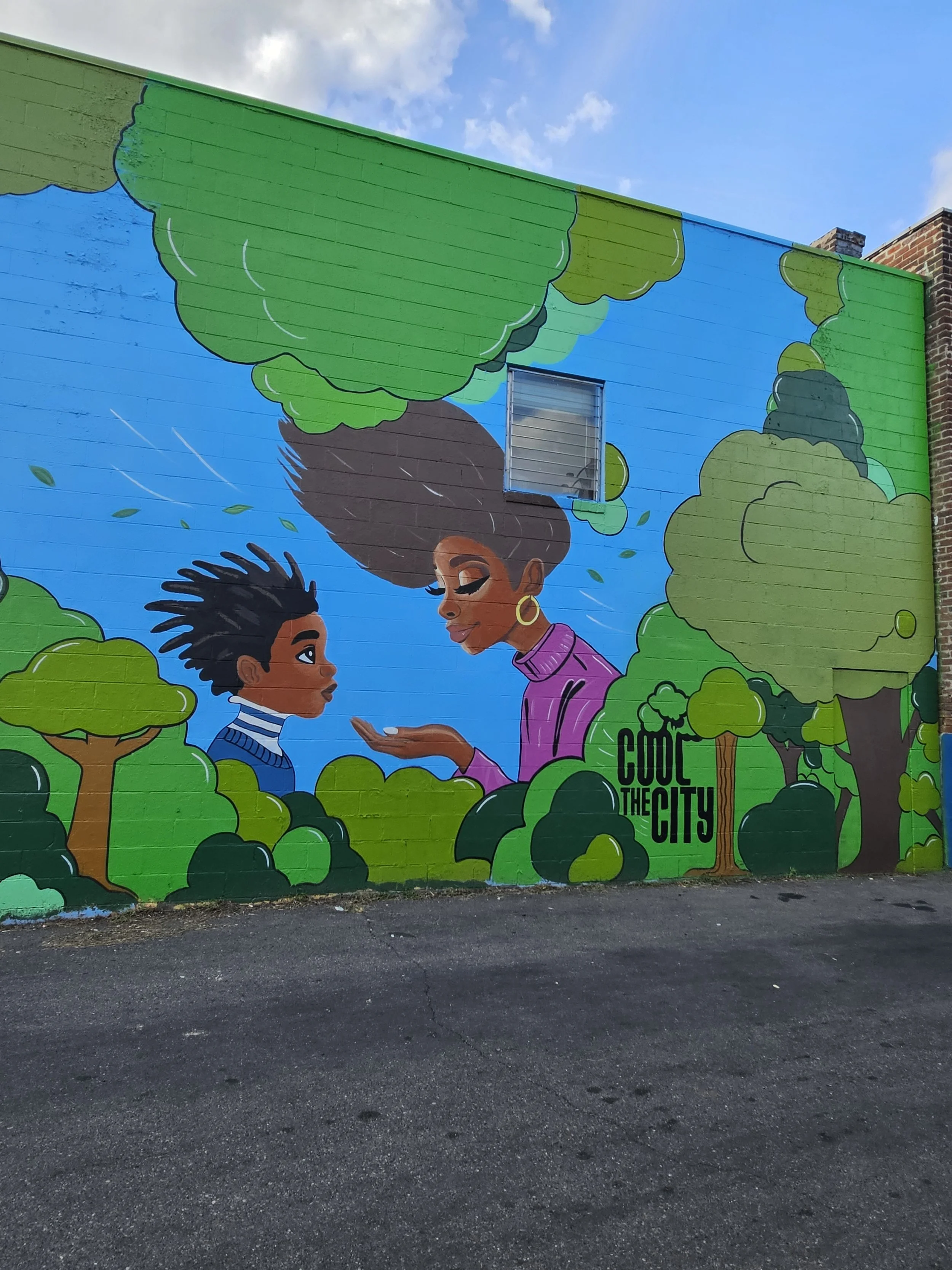 Public mural at 411 N 1st Street by Richmond artist Paris Allen.