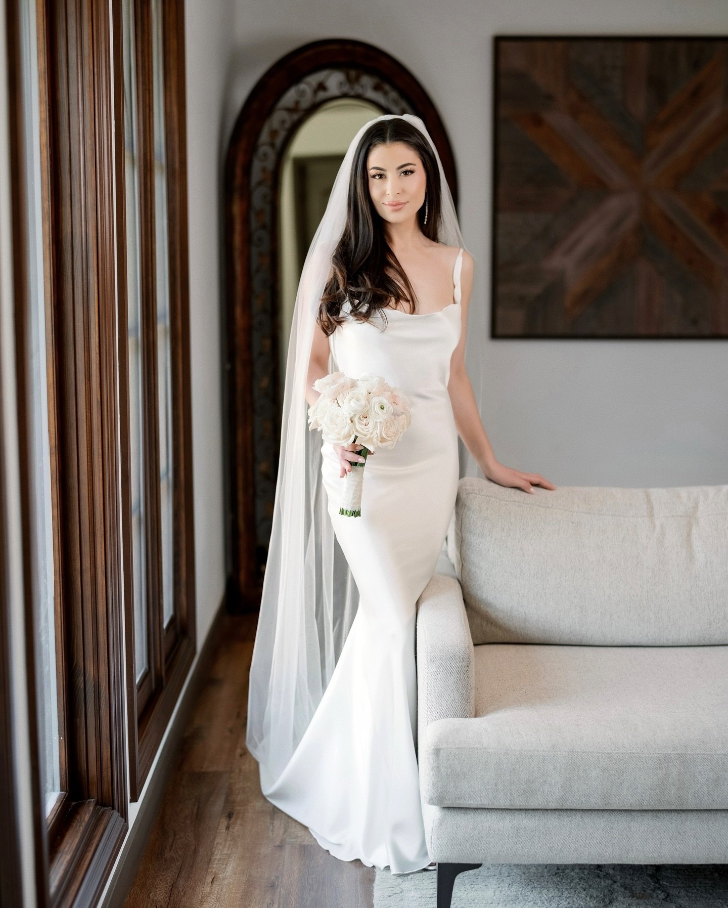 Breathtaking in her silk gown &mdash; radiating a presence of timeless beauty and grace as she prepares to marry the love of her life 🤍🩶

Photography @weddingstoryla 
Gown @karozabridalinc 
Planning @byynatalie 
Venue @chevychasecc 
Glam @annahartm