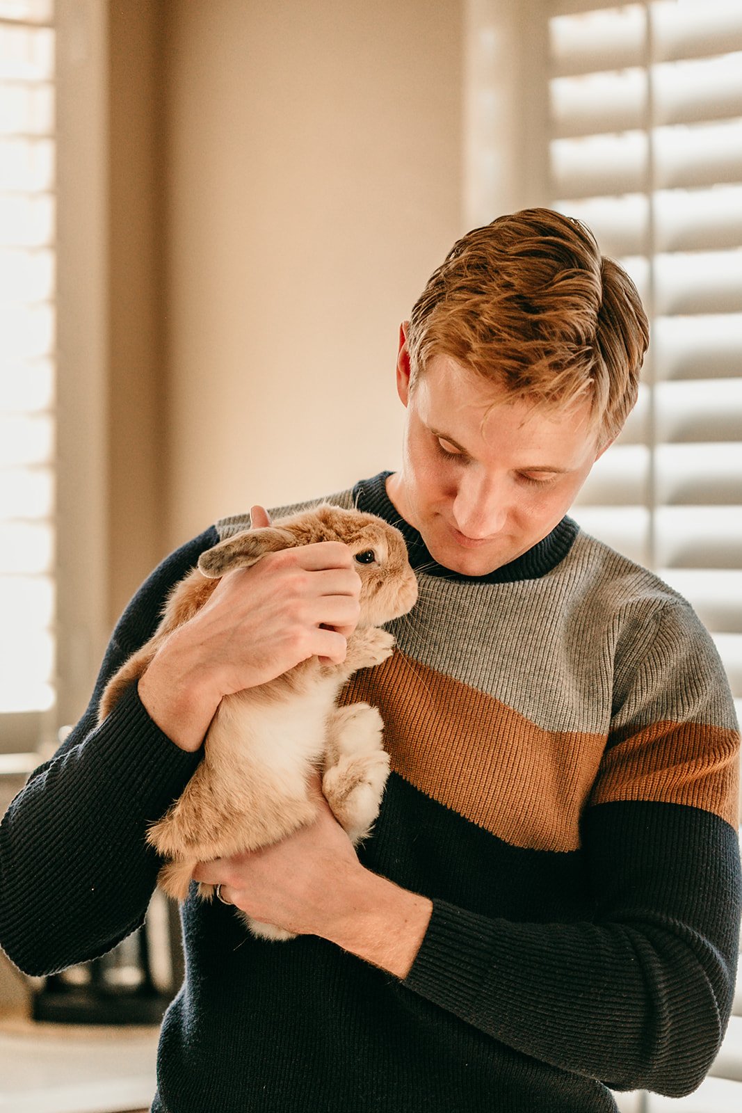 father-holding-rabbit-with-care.jpg