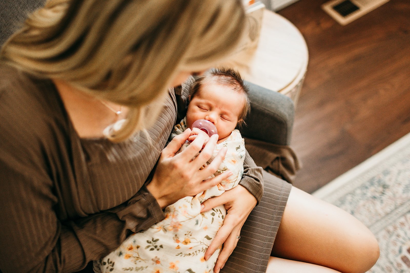 mother-bottle-feeding-newborn-chairs.jpg