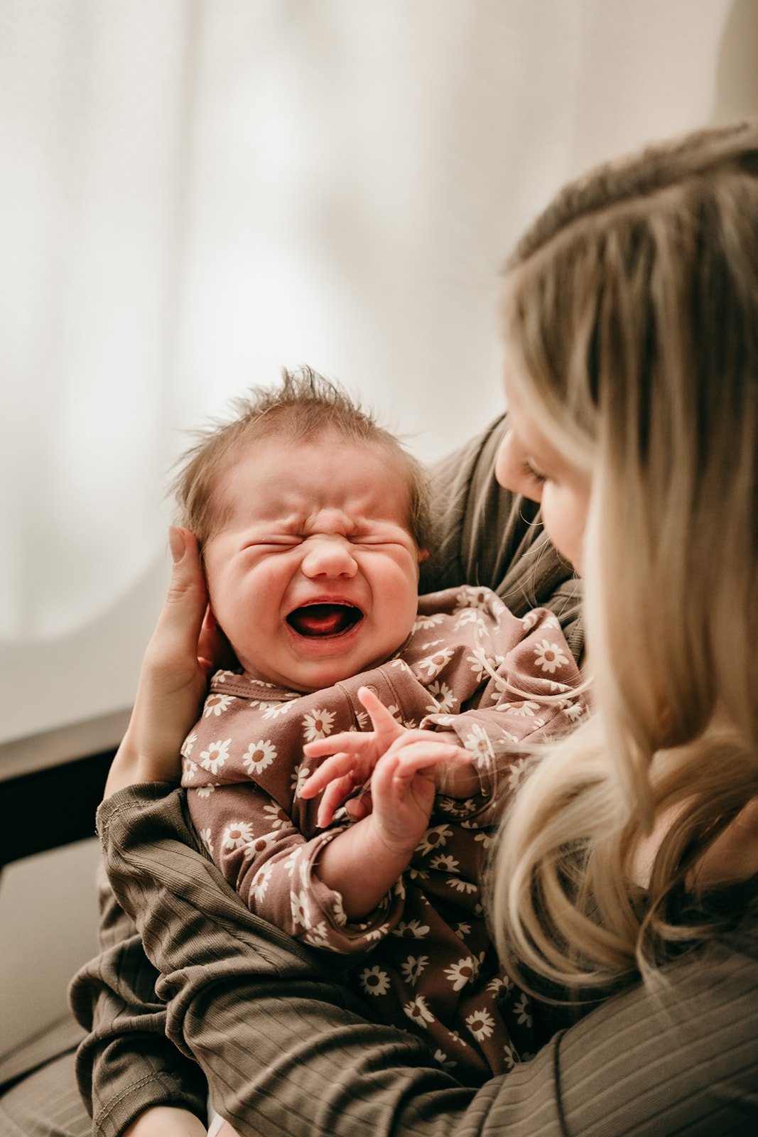 mother-comforting-crying-newborn.jpg