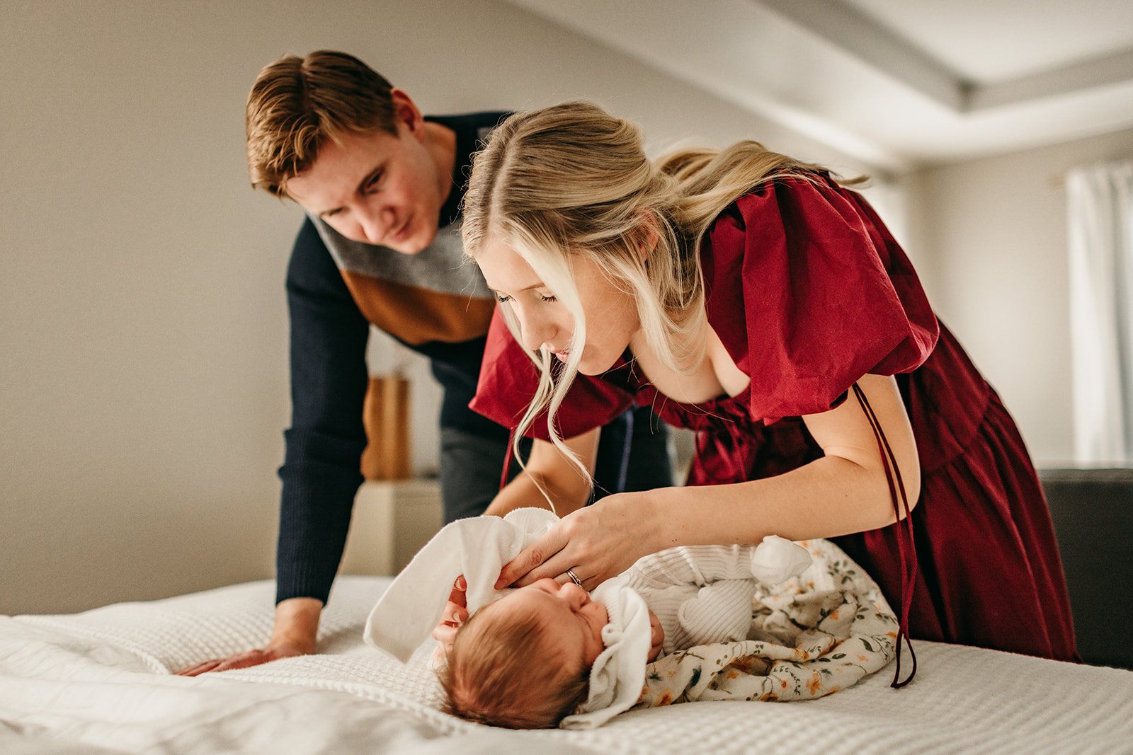 mother-tenderly-wrapping-newborn.jpg