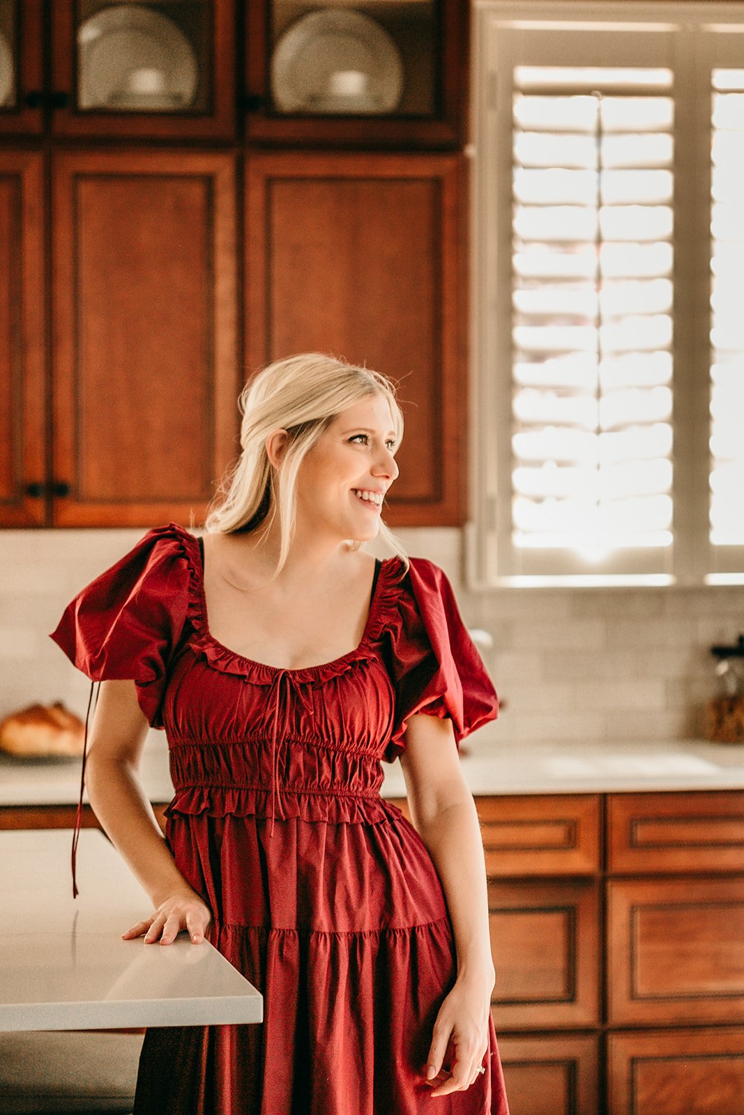 new-mom-wearing-dress-in-kitchen.jpg